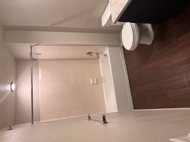 Bathroom with vanity and tub