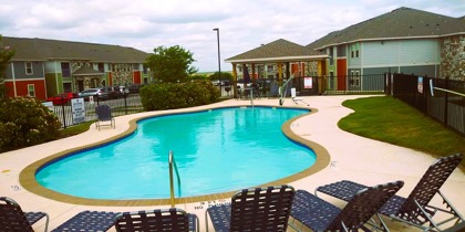 Bedroom with carpet and two windows